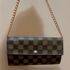 Authentic Preowned Louis Vuitton Damier Ebene Wallet. In great condition.